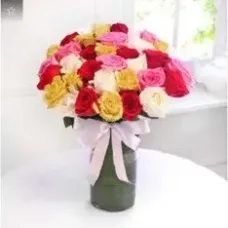 Arrangement of 35 Roses in a Glass Vase