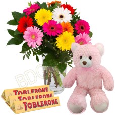 Mix gerberas with bear and chocolates
