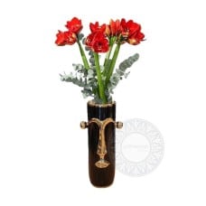 Amaryllis in a vase shaped like a face
