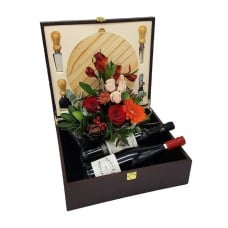 Cheese board with 2 wines and flowers