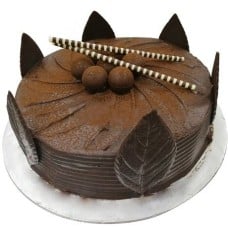 American Chocolate Delight with Flower Hand Bouquet (0.5kg cake with 6 stalk (Carnations OR Roses))