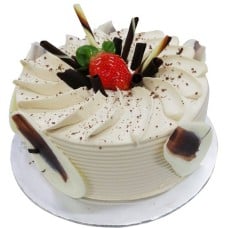Coffee Delight with Flower Hand Bouquet (500 G Cake With 6 Stalks Carnations)