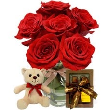 Red Roses Vase , Chocolates And A Free Teddy Bear