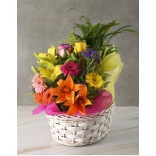 Plant With Flower Arrangement In A Basket