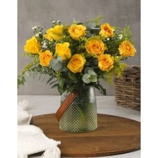Yellow Roses In A Leather Handle Vase