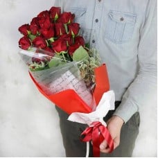 19,red,roses,with,pittosporum,in,bright,packaging