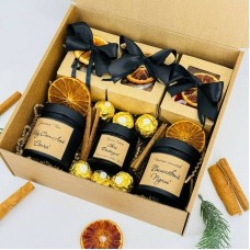 A,gift,set,of,tea,with,Ferrero,Rocher,chocolates,,nuts,,and,a,candle,in,a,handmade,jar.,Gift