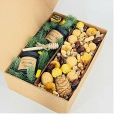 Gift,a,box,with,nuts,,dried,fruit,,milk,and,elite,tea.,Gift,for,the,New,Year.,Home