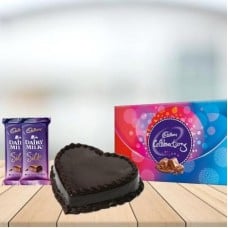 Heart Chocolate Cake with Assorted Chocolates Combo (1/2 kg Heart Chocolate Cake With Cadbury Celebration and 3 Cadbury Dairy Milk Silk (60 gm))