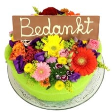 Flower cake with thank you bar (Medium multicolored flower cake with a Thank You bar on a glass plate)