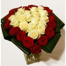 Heart-shaped bouquet of red and white roses