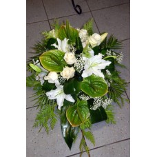 Funeral arrangement of white roses, lilys and anthuriums