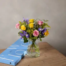 A joyful bouquet of yellow and pink roses