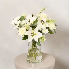 An elegant bouquet of white roses and lilies