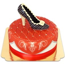 Red deluxe cake with chocolate shoe and ribbon
