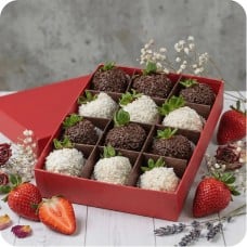 Strawberries in dark and white chocolate with cocoa and coconut sprinkles