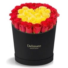 Red and yellow roses heart shaped in a black box