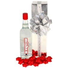A bottle of vodka with some yummy chocolates!