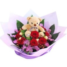 Bear on Flower Bed