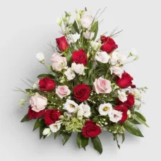 arrangement of red and pink roses