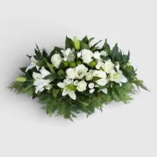 arrangement of lilies, roses, eustoma