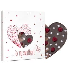 Dark and milk chocolate heart with raspberries