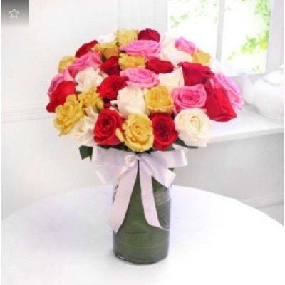 Arrangement Of 35 Roses In A Glass Vase (As Shown)