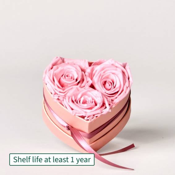 3 long-lasting light pink roses in a heart-shaped box