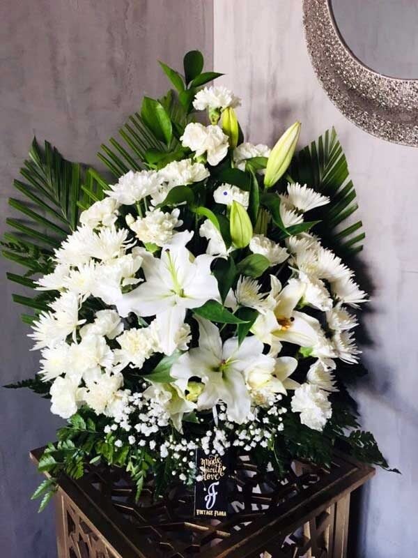 Peaceful White Lilies In A Basket