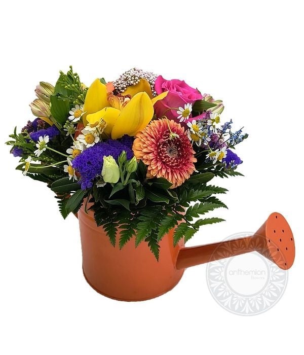 Charming watering can with flowers