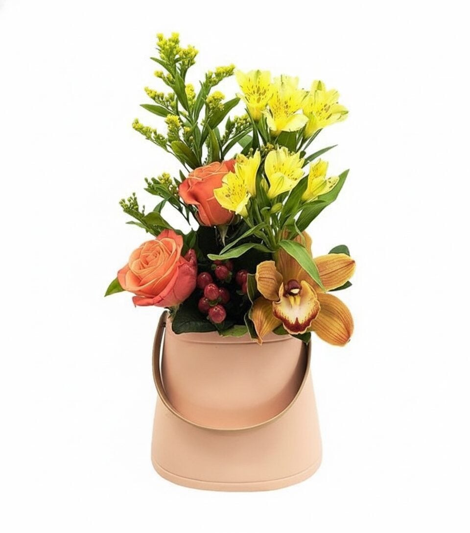 Orange flower arrangement in a ceramic bag