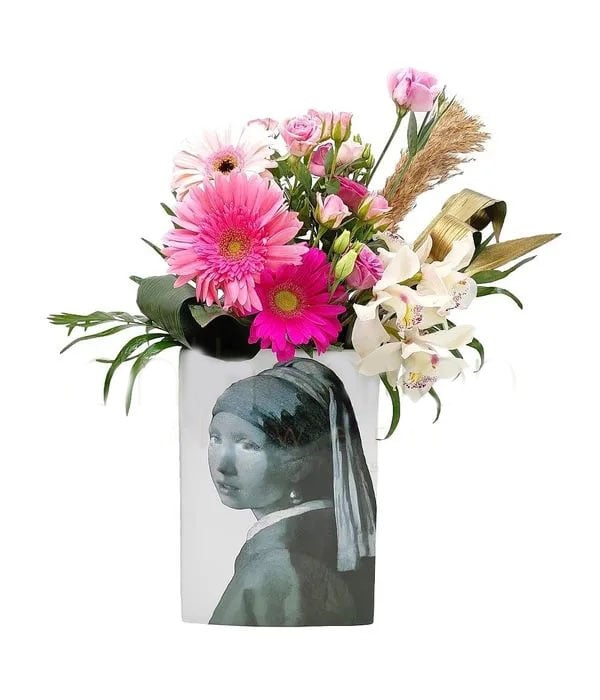 Pink floral arrangement in ceramic vase