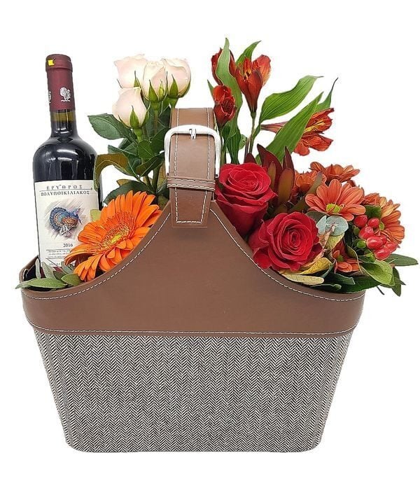 Flowers and wine in leather handbag