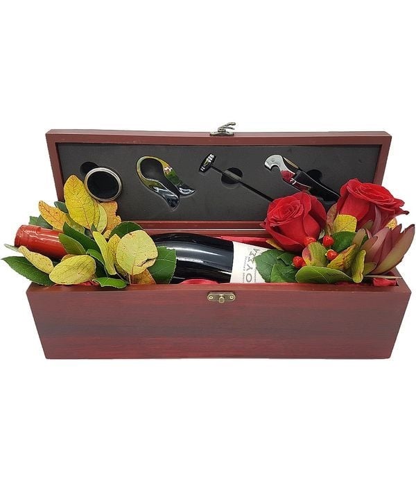 Wooden case with a bottle of wine and accessories