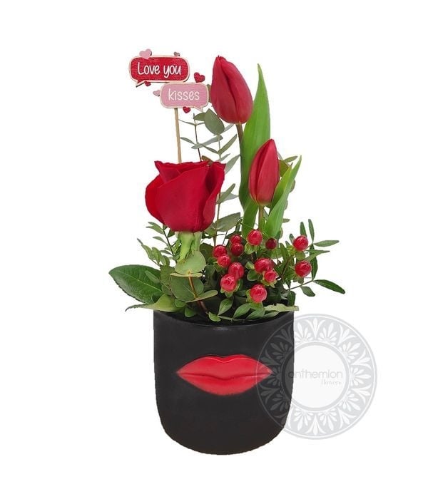 Rose and tulips in a black beauty