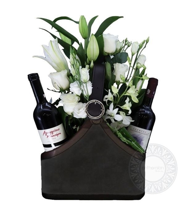 Black newspaper case with two wines and white flowers