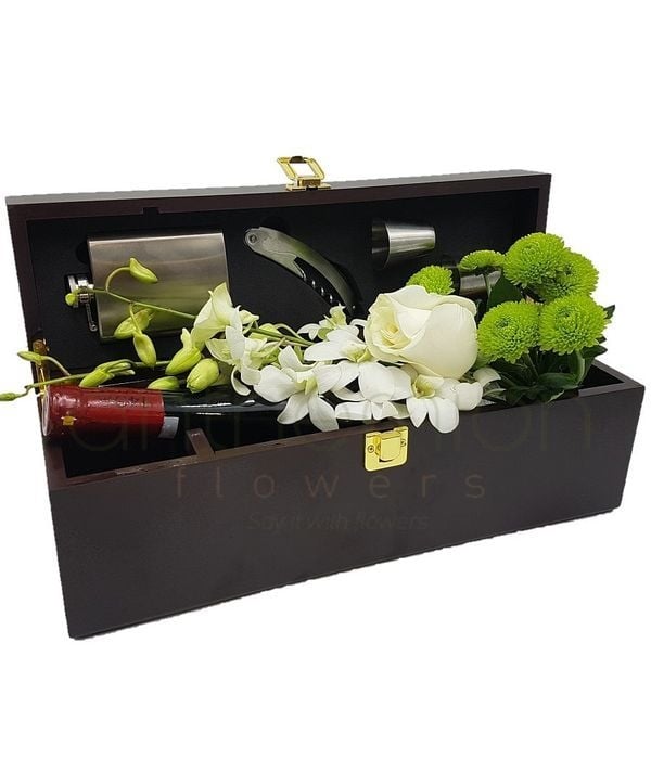 Flowers and wine in a gift box