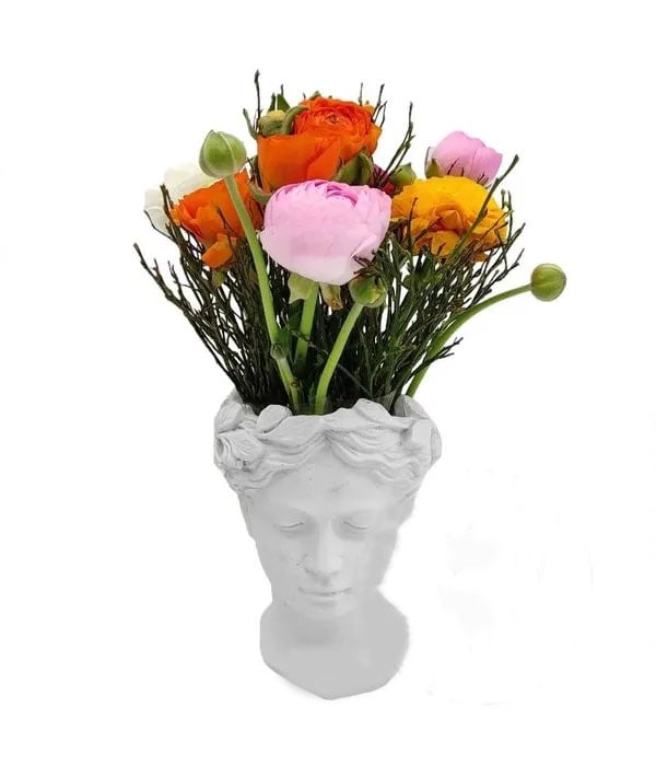 White ceramic hear with spring flowers