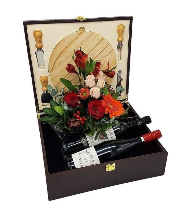 Cheese board with 2 wines and flowers