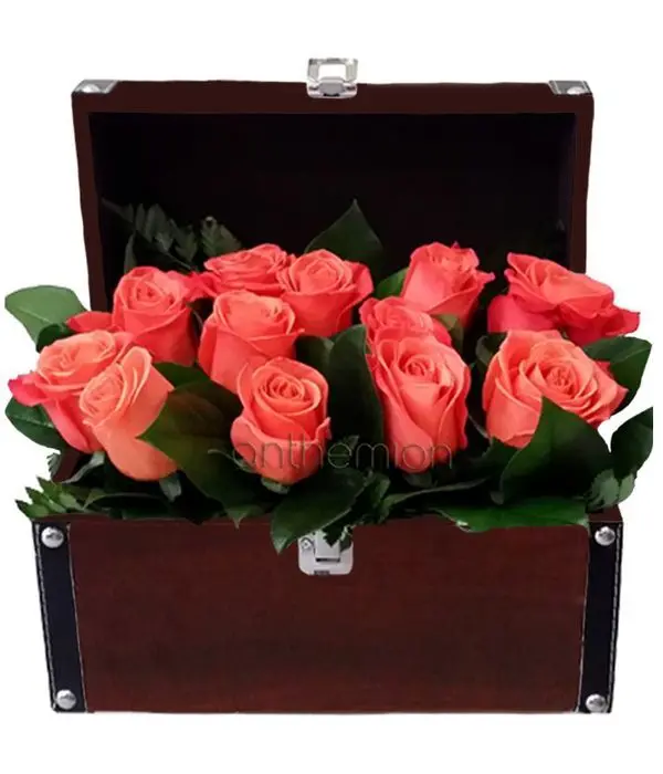 Orange roses in leather trunk
