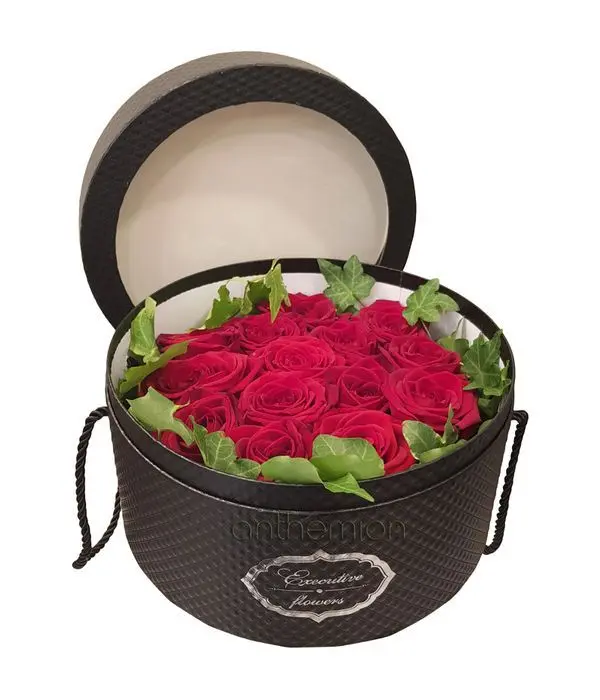 Red roses in round black box