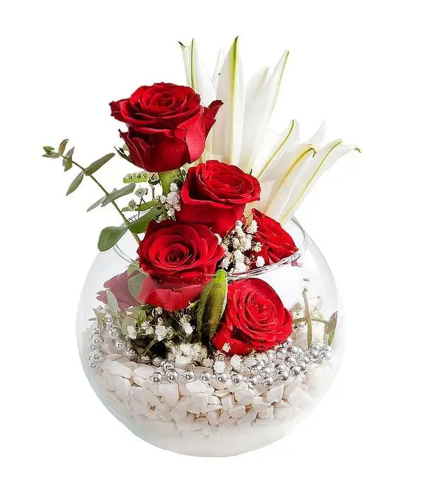 Roses and lilies in glass fishbowl
