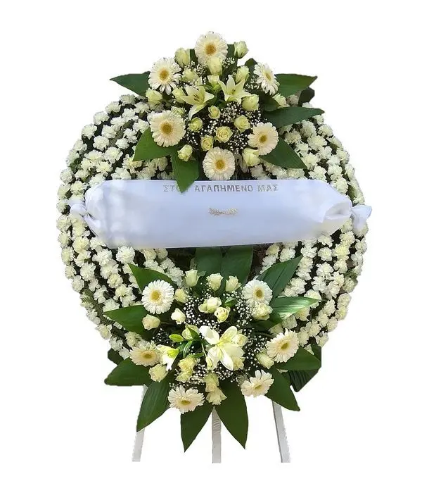 White funeral wreath with extra arrangements