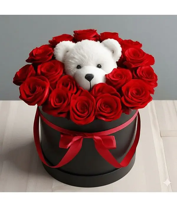 Red roses ιν α gift box with a teddy bear