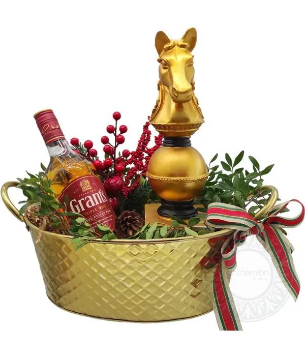 Arrangement with whiskey and decorative chess pawn