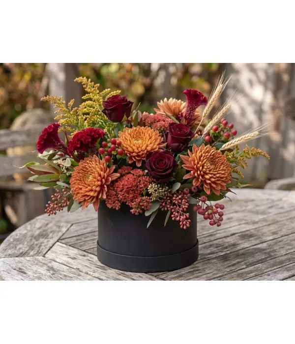 Autumn Floral Arrangement in a Black Hatbox with Burgundy and Orange Flowers