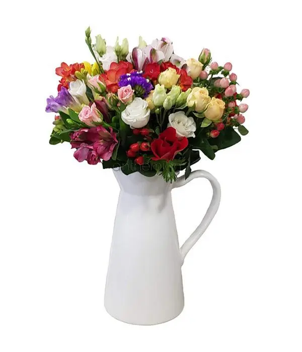Seasonal bouquet in jug