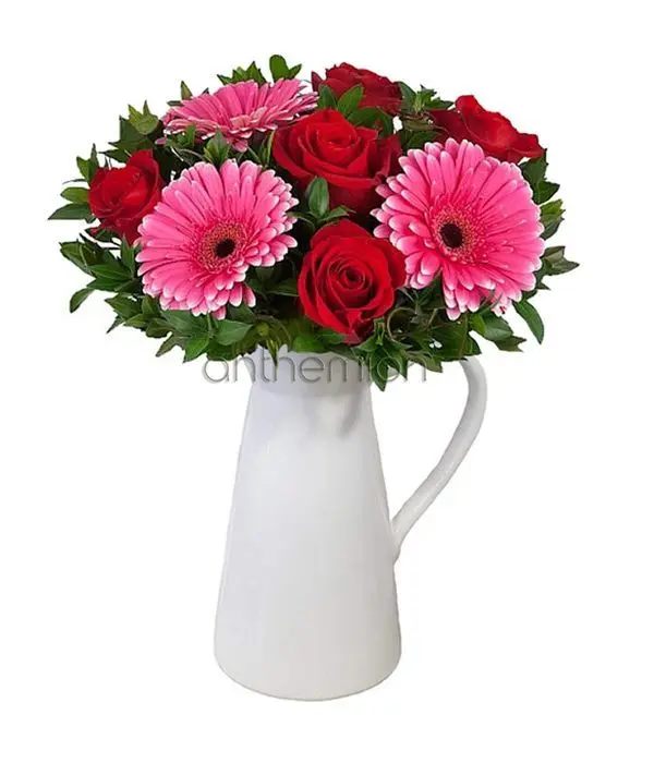 Gorgeous roses and gerberas in jug