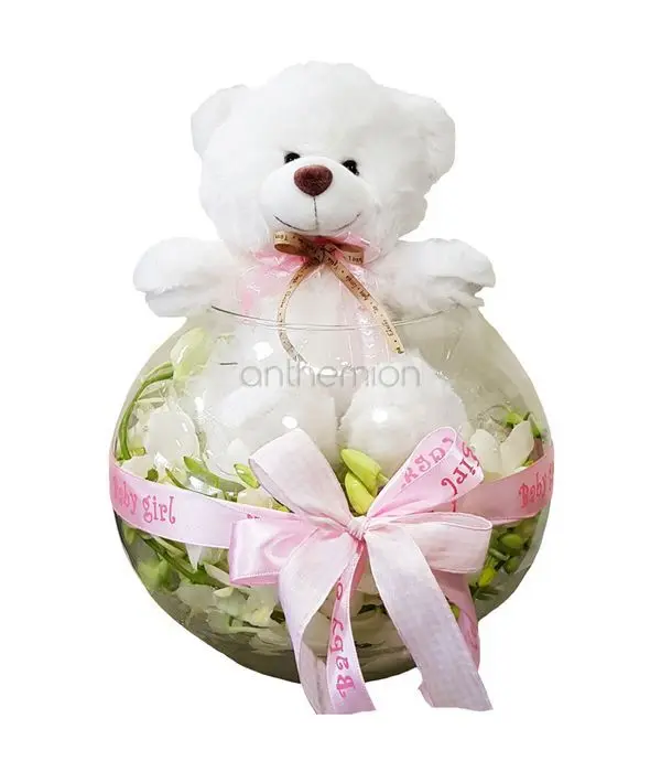 Glass ball with orchids and pink teddy bear