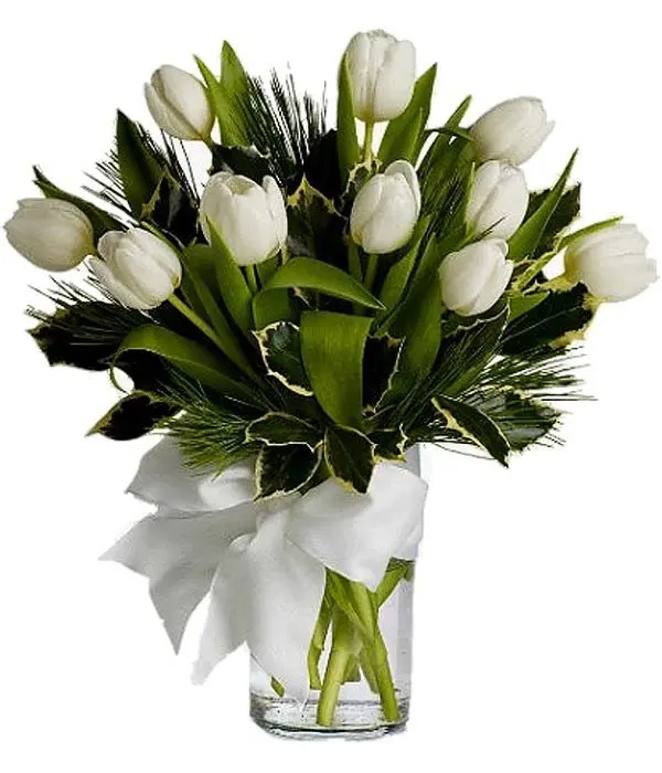 Ten white tulips in a glass vase